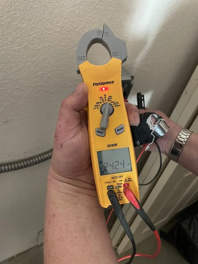 Voltage testing with clamp meter during Electrical Installation Services in Apopka